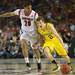 Michigan freshman Spike Albrecht dribbles the ball around Louisville Wayne Blackshear during the second half of the national championship game at the Georgia Dome in Atlanta on Monday, April 8, 2013. Melanie Maxwell I AnnArbor.com